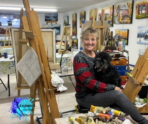 Guylaine L. artiste peintre en atelier et son chien